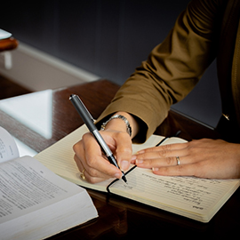 Woman writing in a notebook